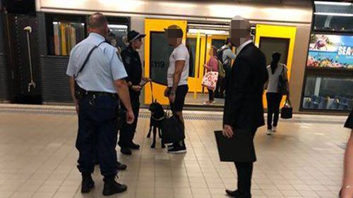 Police patrol a platform at Bondi Junction with a drug dog