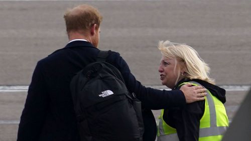 Prince Harry, Duke of Sussex boards a flight at Aberdeen Airport.