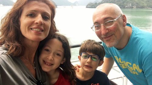 Alessando Mannini and his family have been separated by Australia's travel ban, preventing temporary visa holders entering the country.