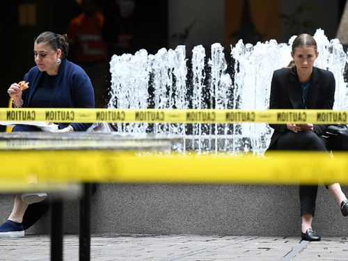 Taped off tables and chairs are seen in a closed cafe after a nationwide shutdown of cafes, restaurants and licensed venues, in Sydney, Tuesday, March 24, 2020.