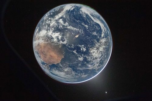 This image provided by NASA shows a view of Earth taken by NASA astronaut and Artemis II Commander Reid Wiseman from of the Orion spacecraft's window after completing the translunar injection burn on April 2, 2026. 