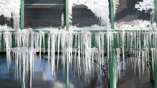 Sub-zero temperatures produce icicles that hang from a restaurant in Minneapolis, Minnesota.