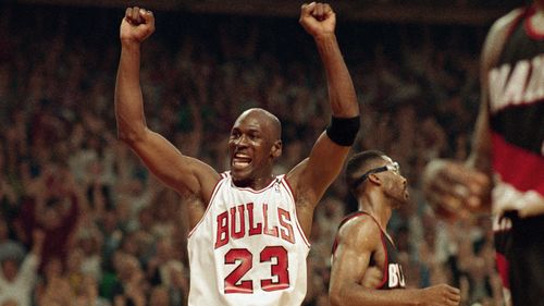 Michael Jordan celebrates the Bulls win over the Portland Trail Blazers in the NBA Finals in Chicago on June 14, 1992. (AP Photo/John Swart, File)