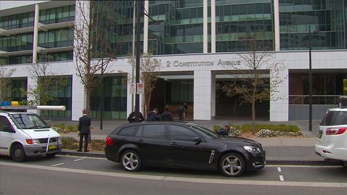 An unmarked AFP car outside the Department of Home Affairs today.