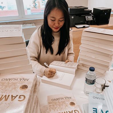 Ana Huang signs books from her Twisted Love series.