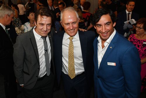 Victoria Australian of the Year finalist Samuel Johnson, Prime Minister Malcolm Turnbull and Queensland Australian of the Year finalist Johnathan Thurston pose for photos. (AAP)