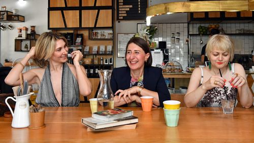 Premier Gladys Berejiklian and sisters Mary (left) and Rita (right) are seen at a cafe during a media opportunity in Willoughby in Sydney on Sunday.