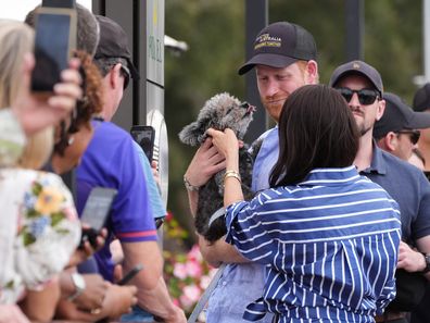 Prince Harry, Duke of Sussex and Meghan, Duchess of Sussex greet members of the public at the Cruising Yacht Club of Australia on April 17, 2026 in Sydney, Australia. 