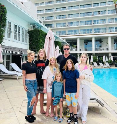 Spelling quelled rumours with a pool-side family picture.