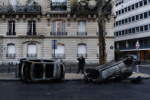 Paris was a scene of overturned and torched cars on Sunday after the Saturday's protest turned ugly.