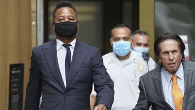 Cuba Gooding Jr., left, and his attorney Mark J. Heller, right, leave court after a hearing in Gooding's sexual misconduct case, Thursday, Aug. 13, 2020, in New York