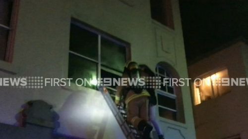 Firefighter rescues woman from Bondi Beach unit fire