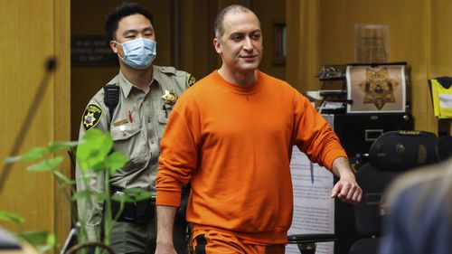 Nima Momeni, the man charged in the fatal stabbing of Cash App founder Bob Lee, makes his way into the courtroom for his arraignment in San Francisco on May 2, 2023. 