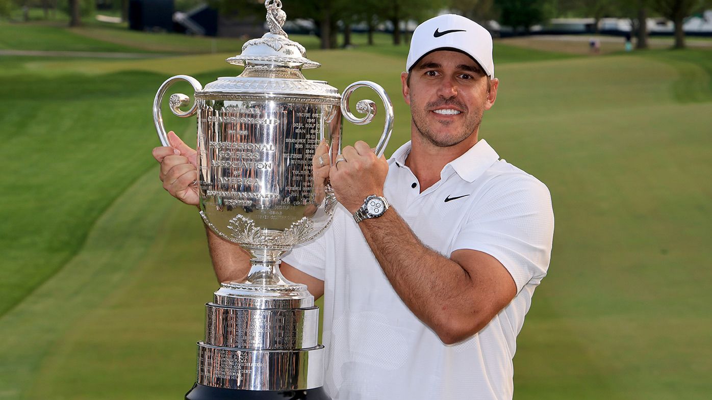 Brooks Koepka of The United States holds the Wanamaker Trophy after his win the final round of the 2023 PGA Championship at Oak Hill Country Club on May 21, 2023 in Rochester, New York. (Photo by David Cannon/Getty Images)