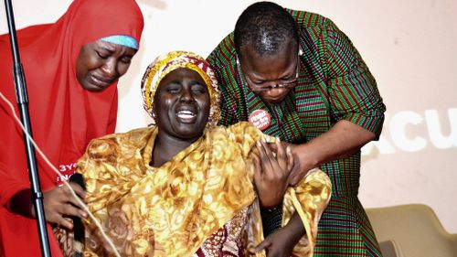 Rebeca Samuel, the mother of one of the abducted Chibok girls, breaks down in tears at an April Bring Back Our Girls event. (AFP)