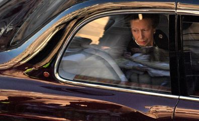 Britain's Princess Anne, Princess Royal looks from the window of a car following the hearse carrying the coffin of Queen Elizabeth II, after leaving from from St Giles' Cathedral on September 13, 2022 in Edinburgh, Scotland. 