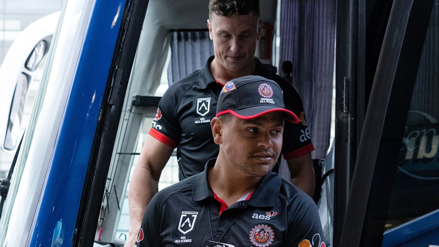 Latrell Mitchell and Jack Wighton arrive at Sydney airport on Monday morning.