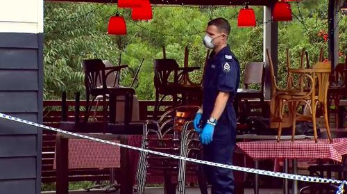 Search for gunman who held up Perth cafe