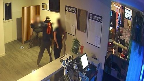 Queensland Police have released new footage of an armed robbery that took place at a hotel north of Brisbane last week, which saw staff threatened with a gun. 