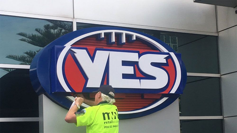 AFL changes logo to "YES" outside headquarters