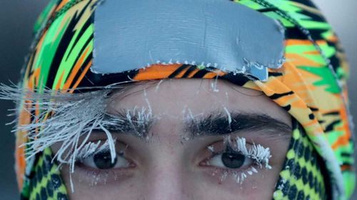 University of Minnesota student Daniel Dylla was frosted in the morning cold while pausing from a jog along the Mississippi River in Minneapolis.
