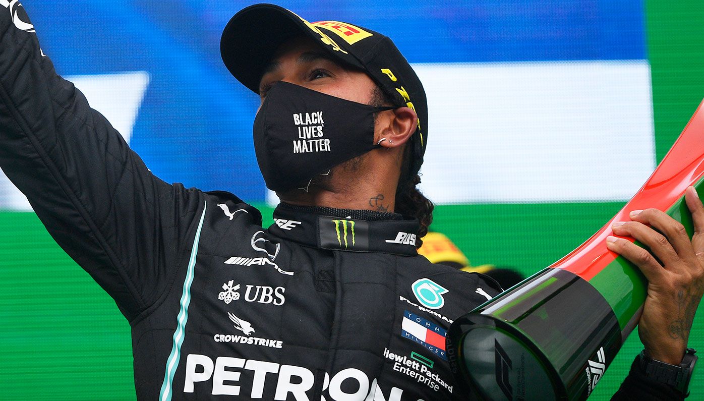 Lewis Hamilton on the podium after winning his record-breaking 92nd grand prix.