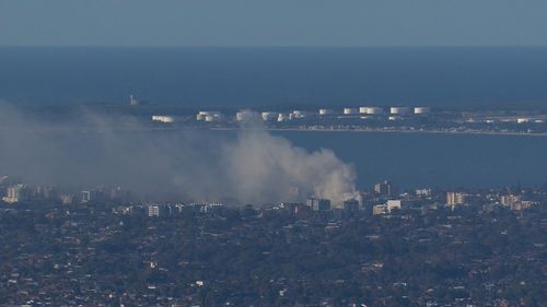 Rockdale warehouse catches on fire sending smoke across city.