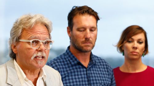 John Ruszczyk (left), the father of Australian woman Justine Damond Ruszczyk, accompanied Jason Ruszczyk (centre) and his wife Katarina, read a statement in front of the media in Sydney on December 21, 2017. (AAP)