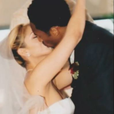 Kobe Bryant kisses Vanessa Bryant at the altar.