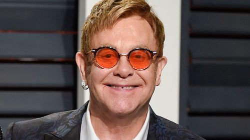 Elton John arrives at the Vanity Fair Oscar Party in Beverly Hills, California on February 27. (AAP)