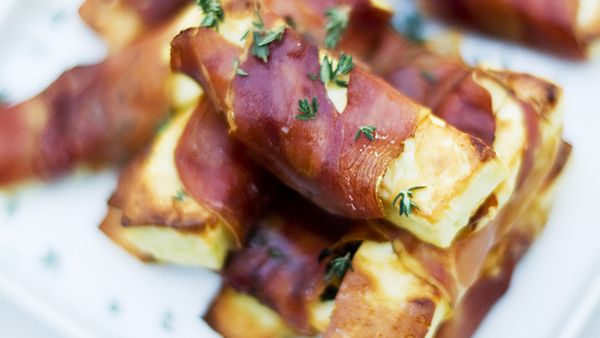 Grilled haloumi wrapped in prosciutto with lemon thyme (Getty)