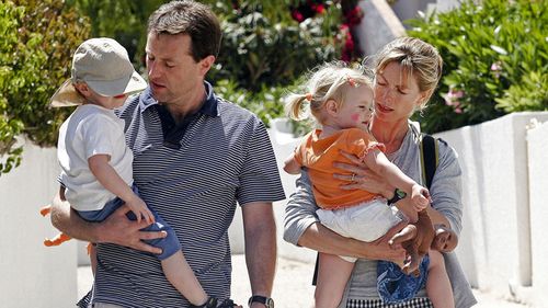 Gerry and Kate McCann, the parents of a missing three-year-old girl Madeleine McCann, walk with their twins outside their resort apartment 11 May 2007, in Praia da Luz, southern Portugal. 