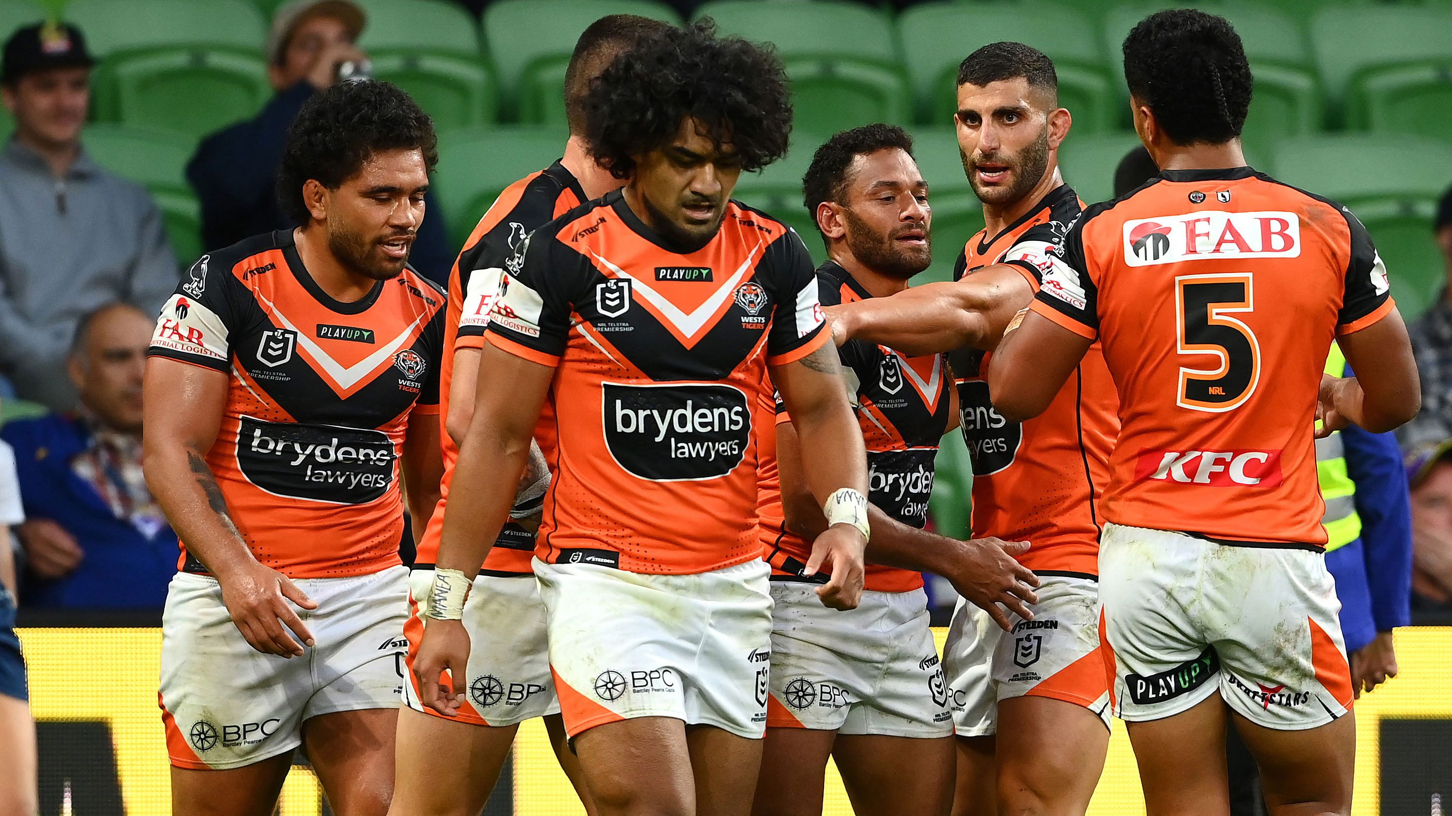 Apisai Koroisau celebrates with Tigers teammates after scoring a try during their round four NRL match against the Melbourne Storm. 