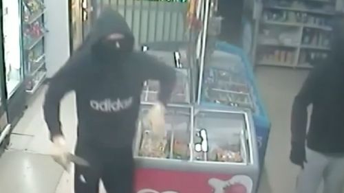 The two men were wearing balaclavas and sunglasses. (9NEWS)