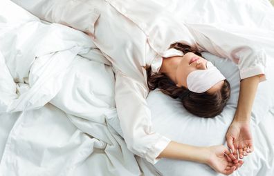 Woman sleeping with sleep mask