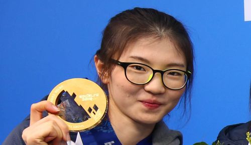 South Korean short track skater Shim Suk-hee with her Olympic gold medal from the women's 3,000m relay in Sochi, Russia.