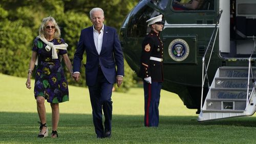President Joe Biden and first lady Jill Biden walk on the South Lawn of the White House after stepping off Marine One on June 27 in Washington. 