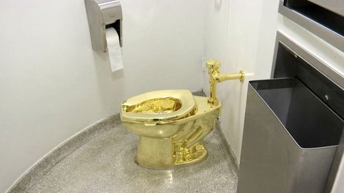 This 2016 file image the 18-karat toilet, titled "America," by Maurizio Cattelan in the restroom of the Solomon R. Guggenheim Museum in New York.