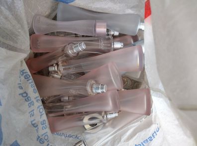 Bag filled with empty perfume bottles