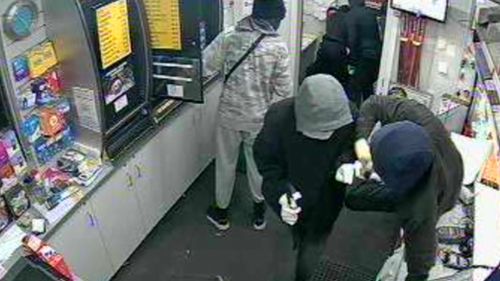 One of the masked robbers leapt over the counter of the Thomastown servo. (Victoria Police)