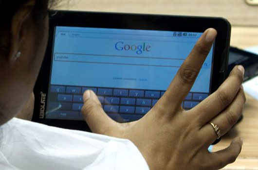 A user browses on the Aakash tablet. (AAP)