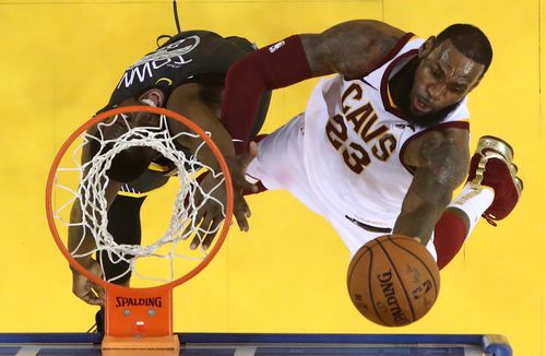 Golden State Warriors player Draymond Green (L) tries to block a shot against Cleveland Cavaliers player LeBron James (R) in the second half of game two of the NBA Finals at Oracle Arena in Oakland, California, on Sunday. Picture: AAP