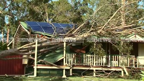 Power still out more than 18 hours after south-east Queensland storms, with more wild weather forecast