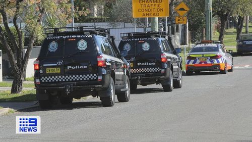 T﻿wo women have been arrested and an alleged underworld figure is on the run after police searched a home in Sydney's south west.
