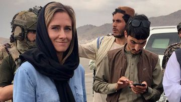 Charlotte Bellis with Taliban officials in September last year.
