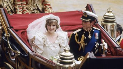 Diana, Princess of Wales and Prince Charles ride in a carriage after their wedding at St. Paul's Cathedral.