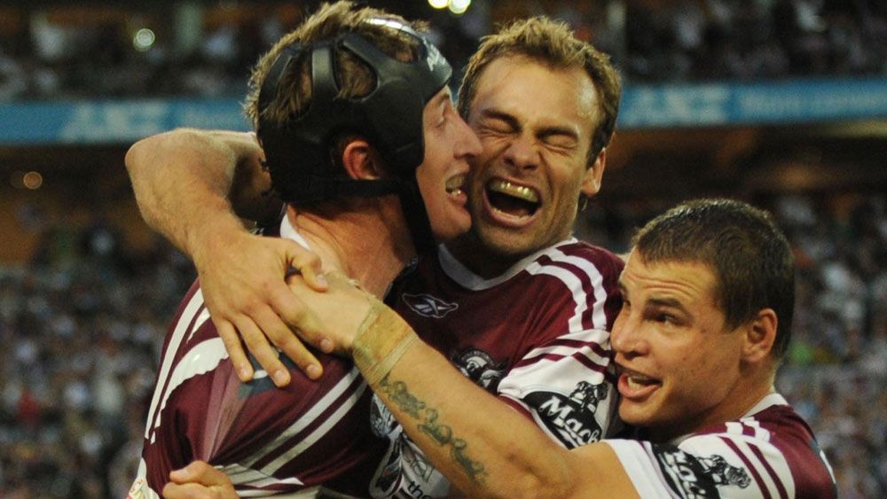 Steve Menzies gets mobbed by Brett Stewart and Anthony Watmough after scoring in the 2008 grand final. (AAP) 