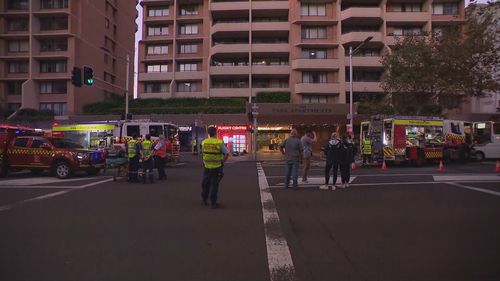 Flames and smoke can be seen coming from level 15 of the apartments on the ﻿corner of Liverpool and Oxford St in Darlinghurst.