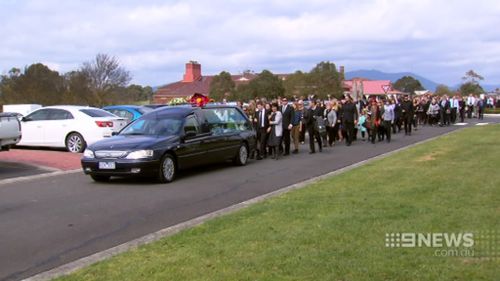 Hundreds of friends and family followed the casket after the service. (9NEWS)