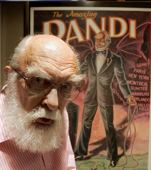 James Randi is shown in front of a poster at his home in Fort Lauderdale, Florida. (AP Photo/Alan Diaz, File)